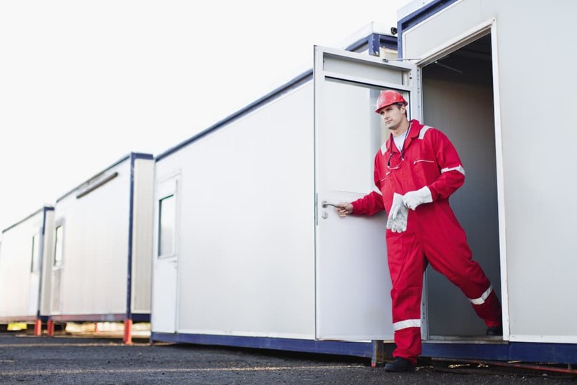 Construction worker leaving site accommodation
