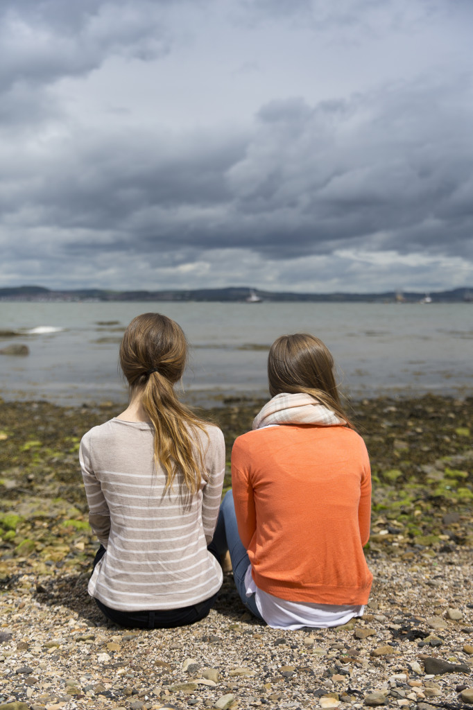 Two friends out together at the coast.