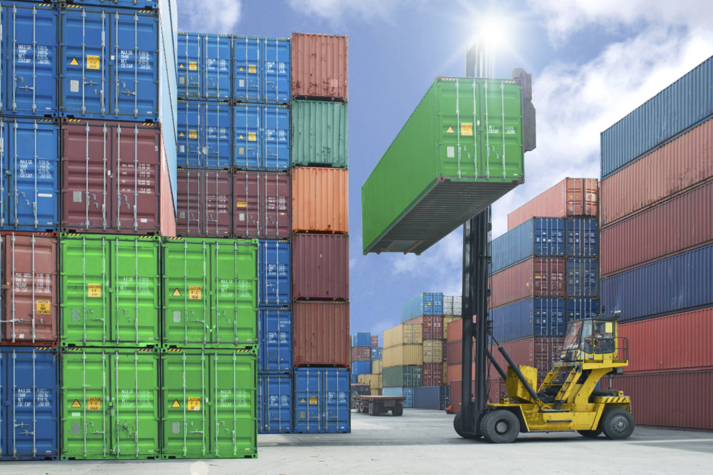 forklift handling container box loading to truck in import expor